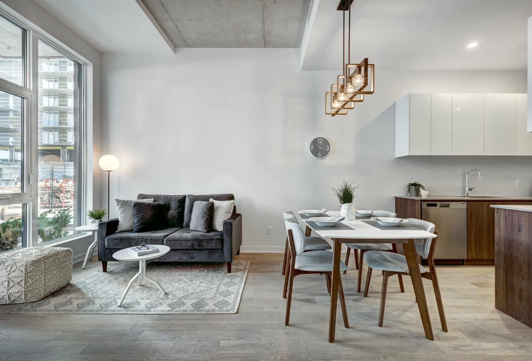 Modern open-plan living and dining area in a Kelowna vacation rental managed by Simply Hosted